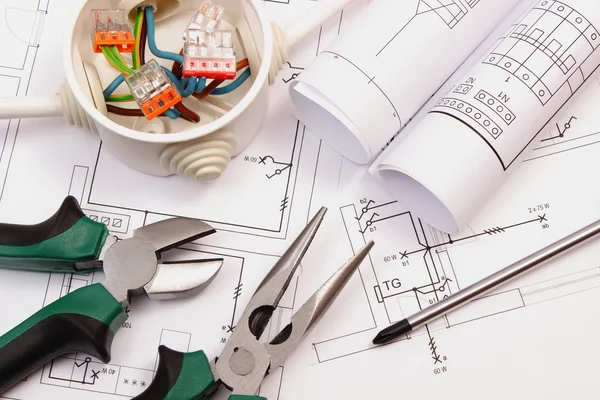 Work tools, electrical box with cables and electrical construction drawing