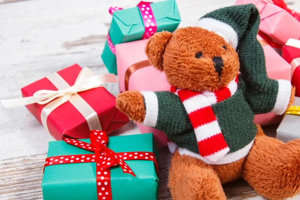 Teddy bear with colorful gifts for Christmas or other celebration