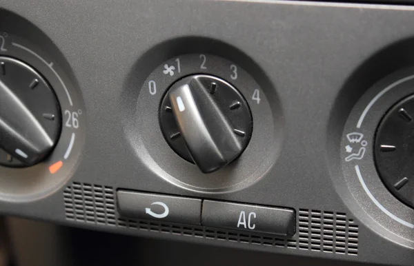 Closeup of air conditioning button in car