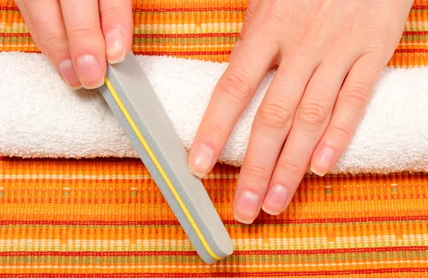 Woman polishing nails, manicure