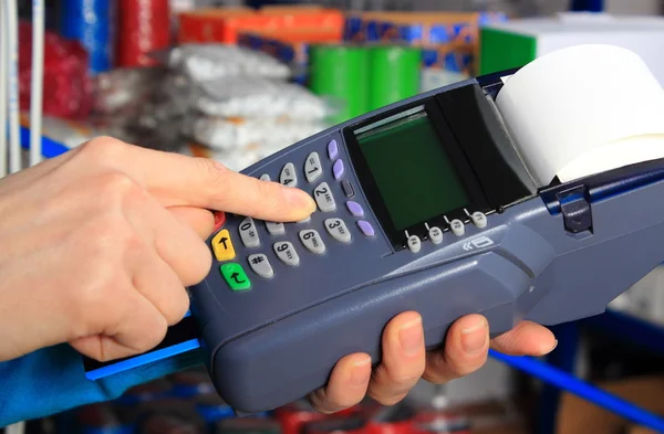 Paying with credit card in an electrical shop, finance concept