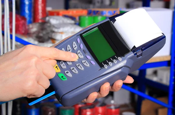 Paying with credit card in an electrical shop, finance concept