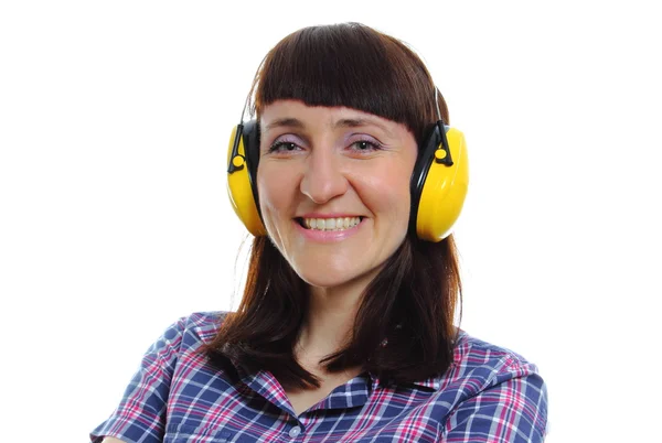 Builder woman wearing protective headphones