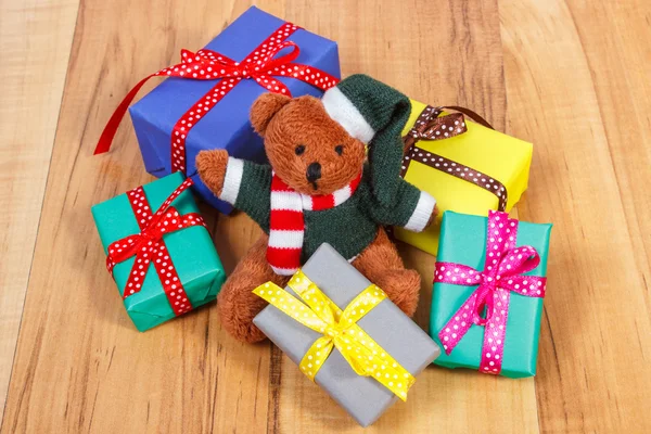 Teddy bear with colorful gifts for Christmas or other celebration