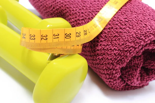 Dumbbells and towel for using in fitness and measure tape