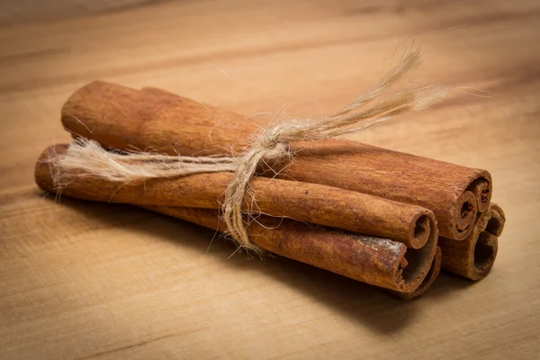 Cinnamon sticks on wooden table, seasoning for cooking