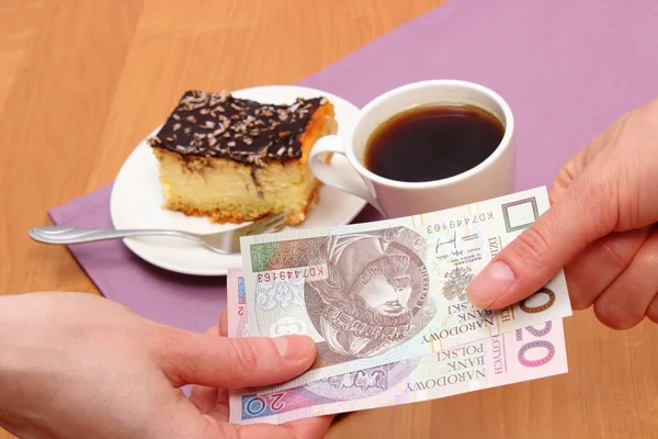 Paying for cheesecake and coffee in the cafe, finance concept