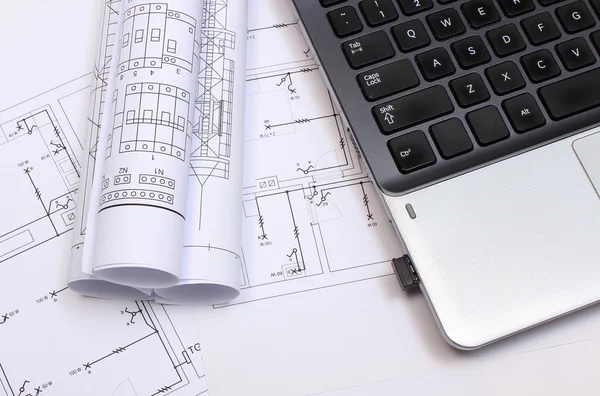 Electrical diagrams, construction drawings and laptop
