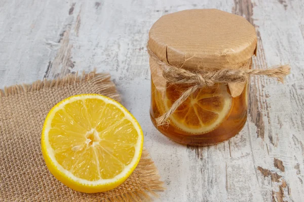 Fresh lemon and honey on wooden table, healthy food and nutrition