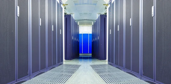 Symmetrical futuristic modern server room in the data center with