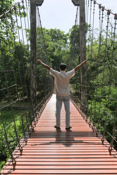 Rope bridge or suspension bridge in forest at Khao Kradong Fores