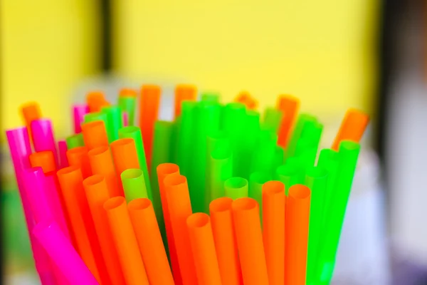 Straw plastic tube color full, selected focus