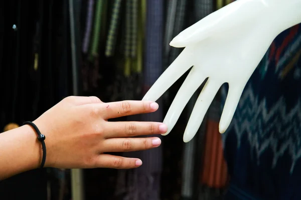 Relation concept : Human hand with plastic hand