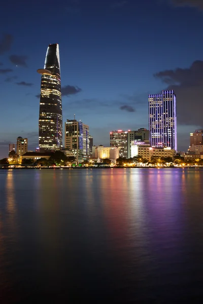 HO CHI MINH CITY, VIETNAM - JULY 21, 2015 : Saigon riverside night view at downtown center with buildings across riverside Saigon river Ho Chi Minh City