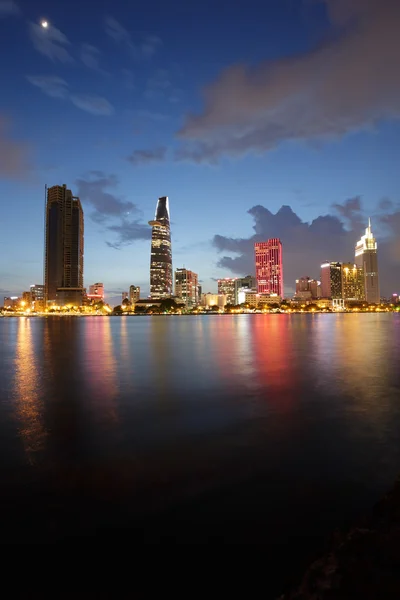 HO CHI MINH CITY, VIETNAM - JULY 21, 2015 : Saigon riverside night view at downtown center with buildings across riverside Saigon river Ho Chi Minh City