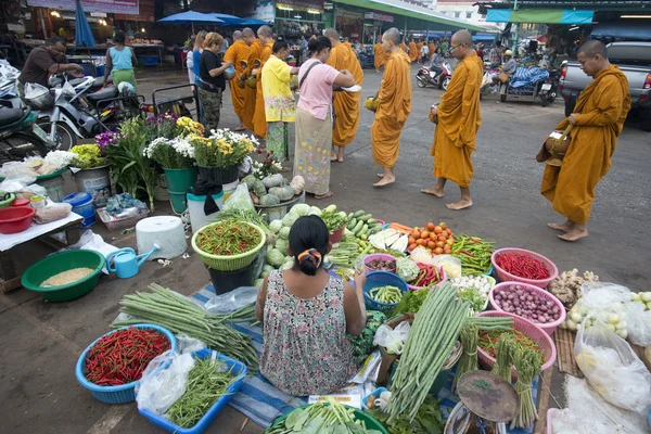 Monks at the market in the Village in Thailand
