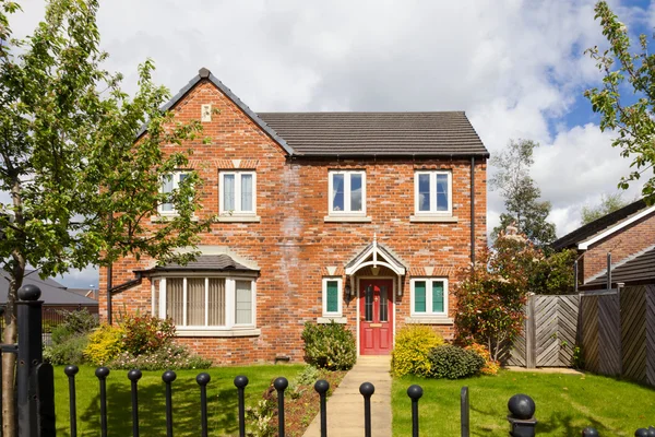 English house with red door