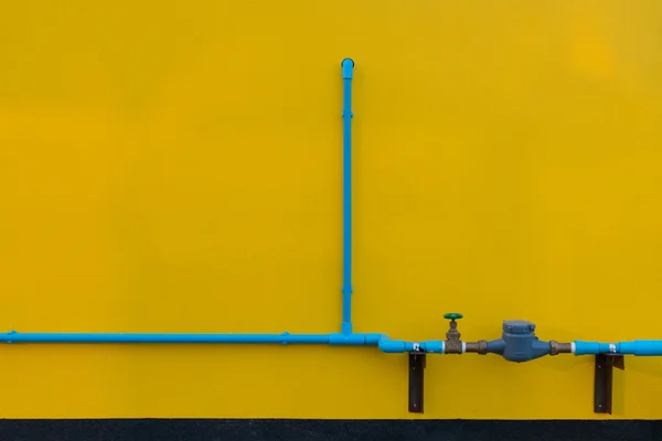 Minimalism style, Blue water tube with valve on the wall.