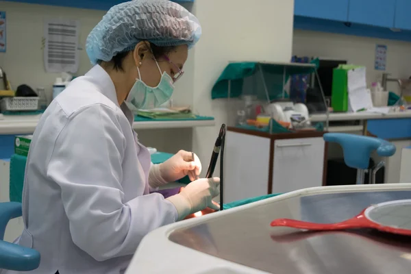 Dentist working for heal dental patients