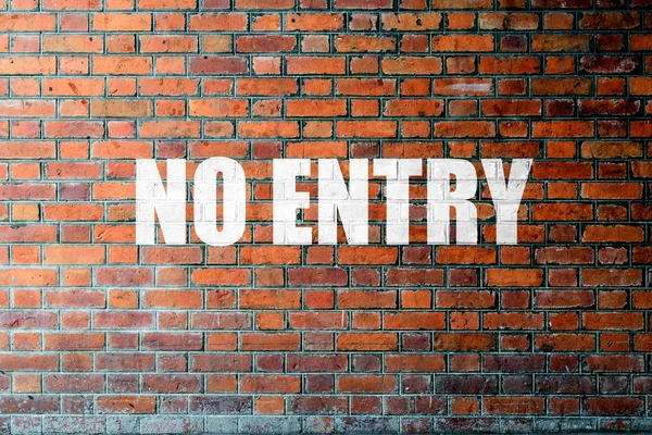 Red Brick wall texture with a word No Entry