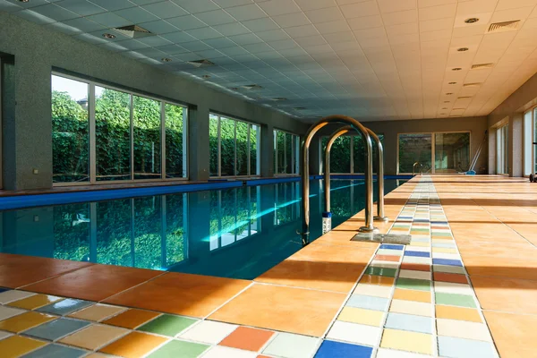Long covered swimmimg pool on resort