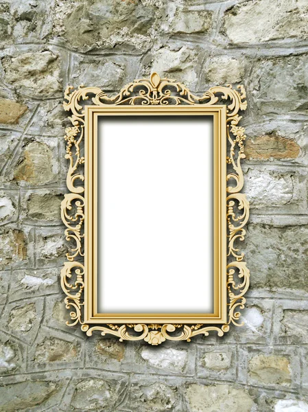 One golden baroque frame on medieval stone wall