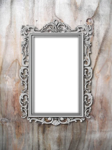 Single silver baroque frame on weathered wooden board