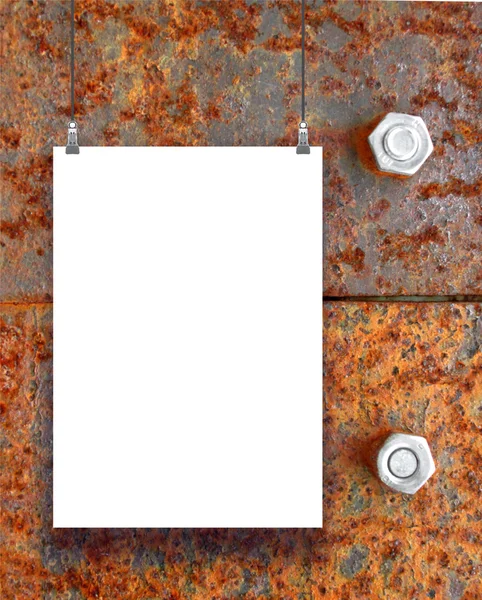 Single hanged paper sheet with clips on brown rusty metal