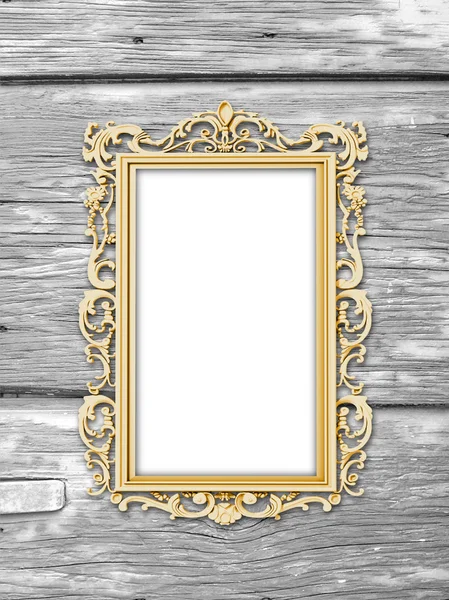 Single golden baroque frame on weathered wooden boards
