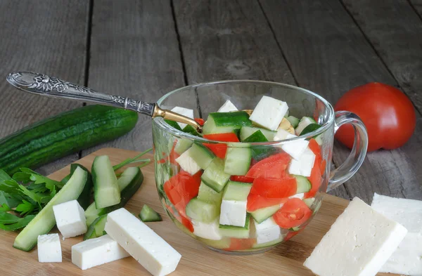 Chopped vegetables for the salad ingredients and spoon