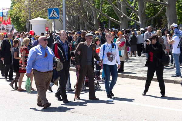 SEVASTOPOL, CRIMEA - MAY 9, 2015: People are columns on parade in honor of the 70th anniversary of Victory Day, May 9, 2015, Sevastopol