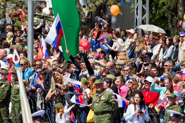 SEVASTOPOL, CRIMEA - MAY 9, 2015: A lot of people watching the p