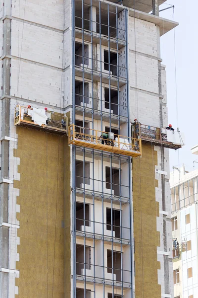 ODESSA - SEPTEMBER 8: facade thermal insulation works with stopp