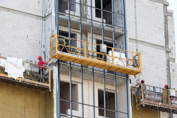 ODESSA - SEPTEMBER 8: facade thermal insulation works with stopp