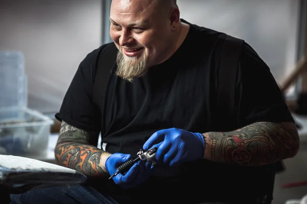 Master tattoo artist prepares tools