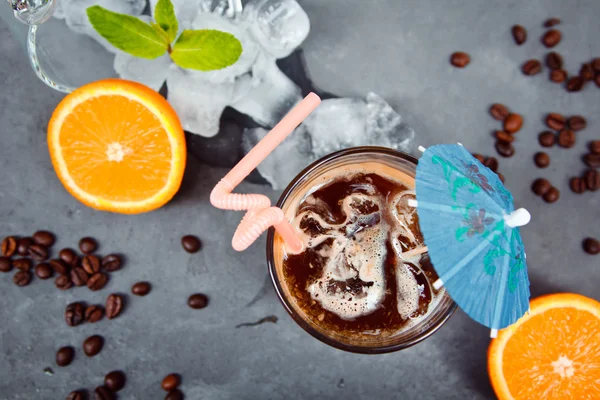 Fresh cocktail with orange, with mint and ice and coffee. Alcoholic, non-alcoholic drink-beverage