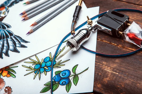 Beautiful sketch drawing with colored pencils lying on old wooden background