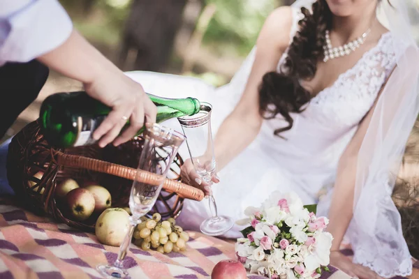 Bride and groom drink