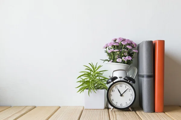 Interior decoration clock with wooden flooring plant