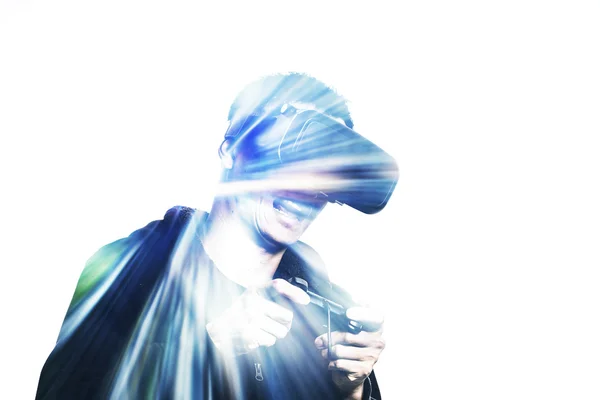 Double exposure of man using the virtual reality headset