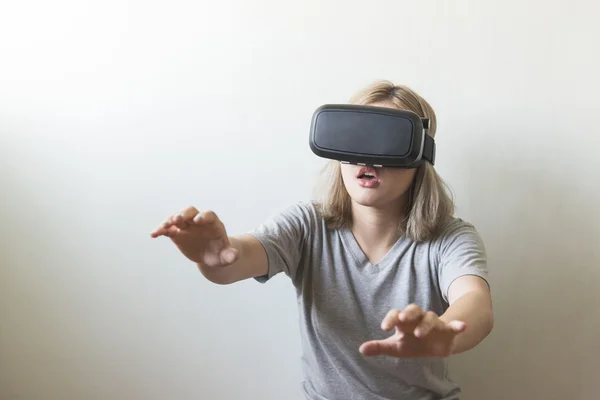 Woman using the virtual reality headset on white background