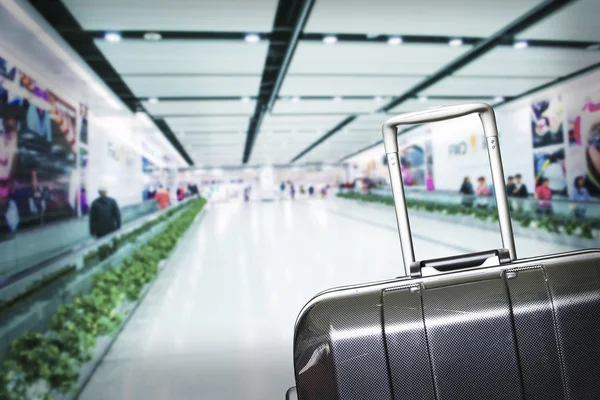 Traveler Suitcases in Airport Terminal Waiting Area
