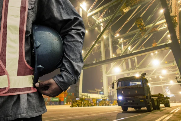 Port worker holding a helmet background