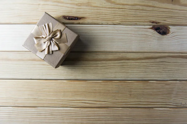 Gift boxes in front of wooden wall