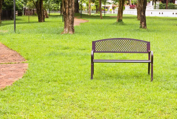 Wooden park bench at the public park image