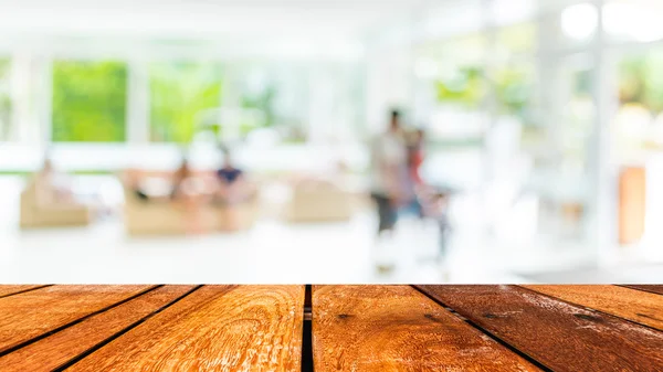 Empty wood table and Coffee shop blur background with bokeh imag