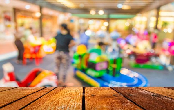 Arcade game machine shop blur background with bokeh image .