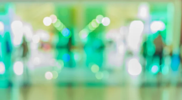 Blur image of people in the lobby of a modern business center