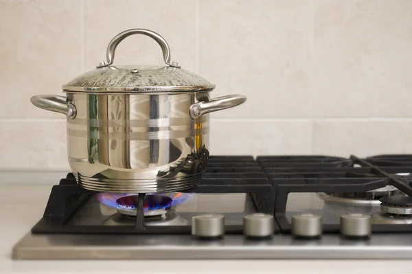 Boiling pot on the gas stove fire