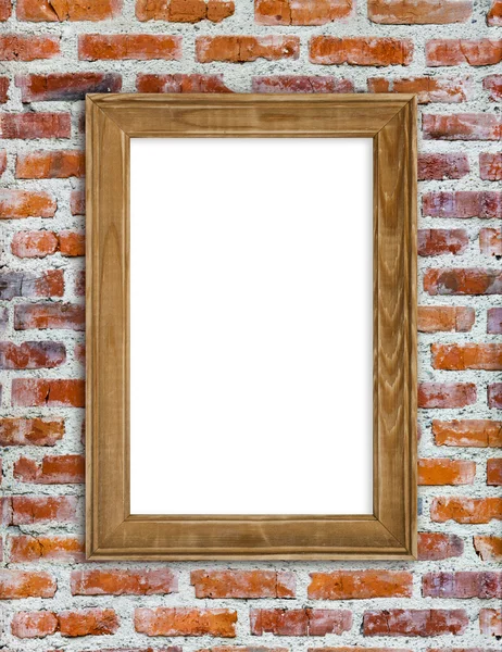 Wooden picture frame hanging on red brick wall